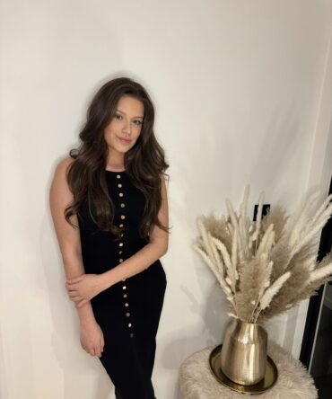 Black midi dress with golden buttons